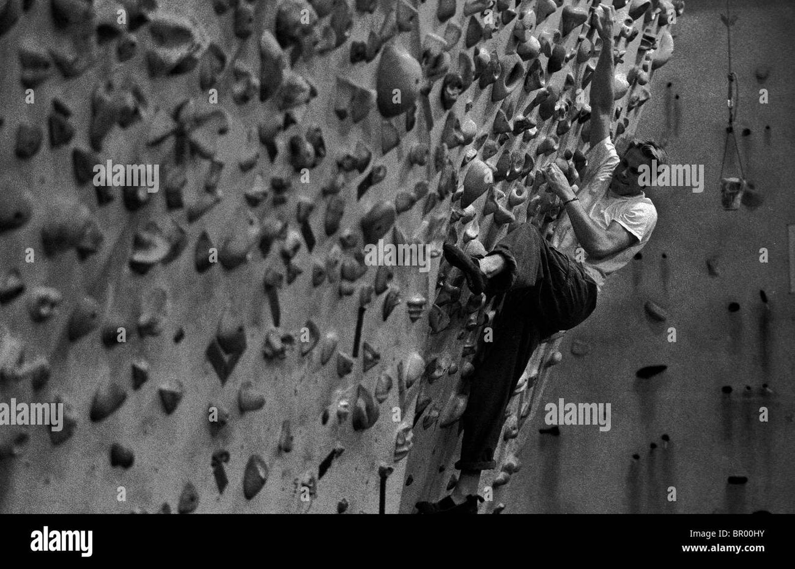 Athlete bouldering on an indoor climbing wall