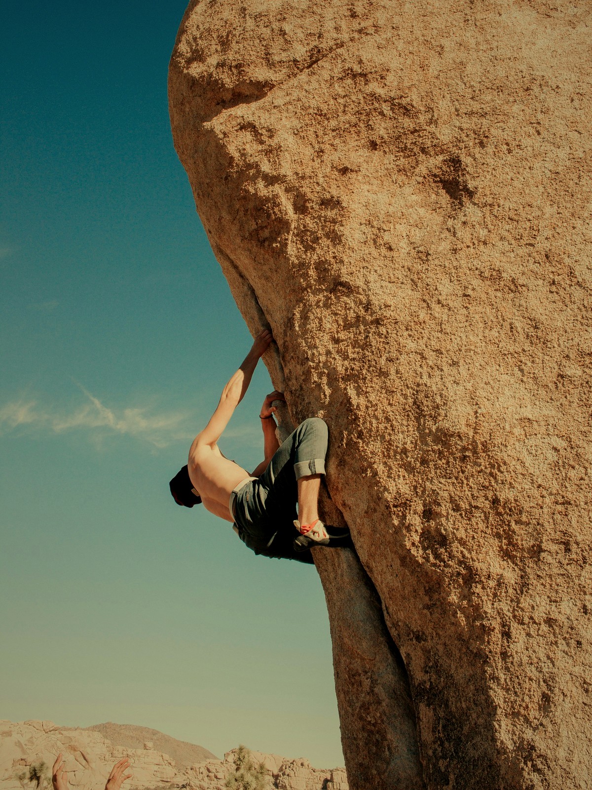 Athlete bouldering on an outdoor rock face